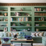 How can painting old built-in shelves the same colour as the wall reduce visual clutter