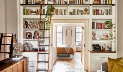 How can replacing mismatched storage boxes with similar ones make shelves look neater