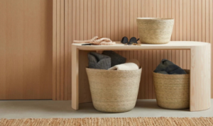 How can using baskets in open storage keep things practical but still visually tidy