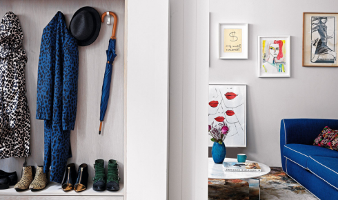 How does adding wall hooks behind doors help reduce everyday clutter at home