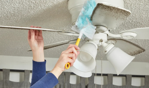 How does cleaning fan blades regularly affect comfort in hot weather