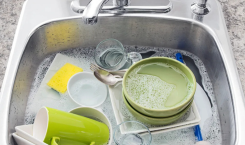 Why does soaking dirty dishes for a while make washing them easier later