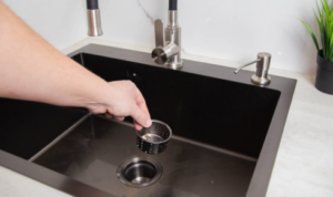 Why is it better to use strainers in kitchen and bathroom drains