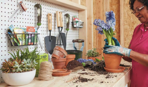 Why is it useful to keep gardening tools in a small, dedicated basket or box